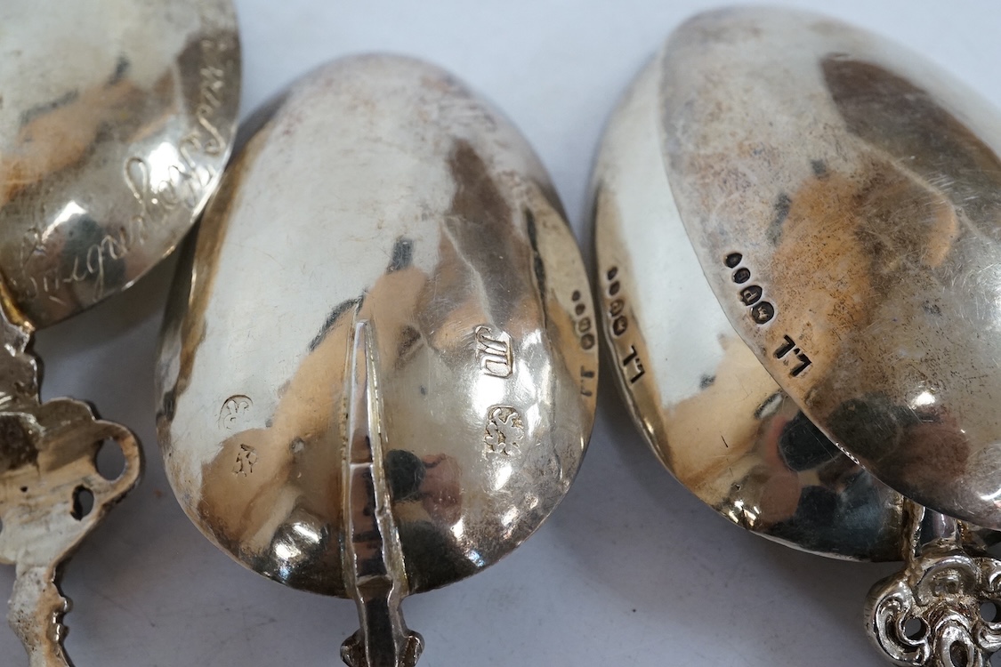 Four 19th century Dutch gilt white metal spoons, including a pair with import marks for Louis Landsberg, London, 1890, 83mm, 7.2oz.